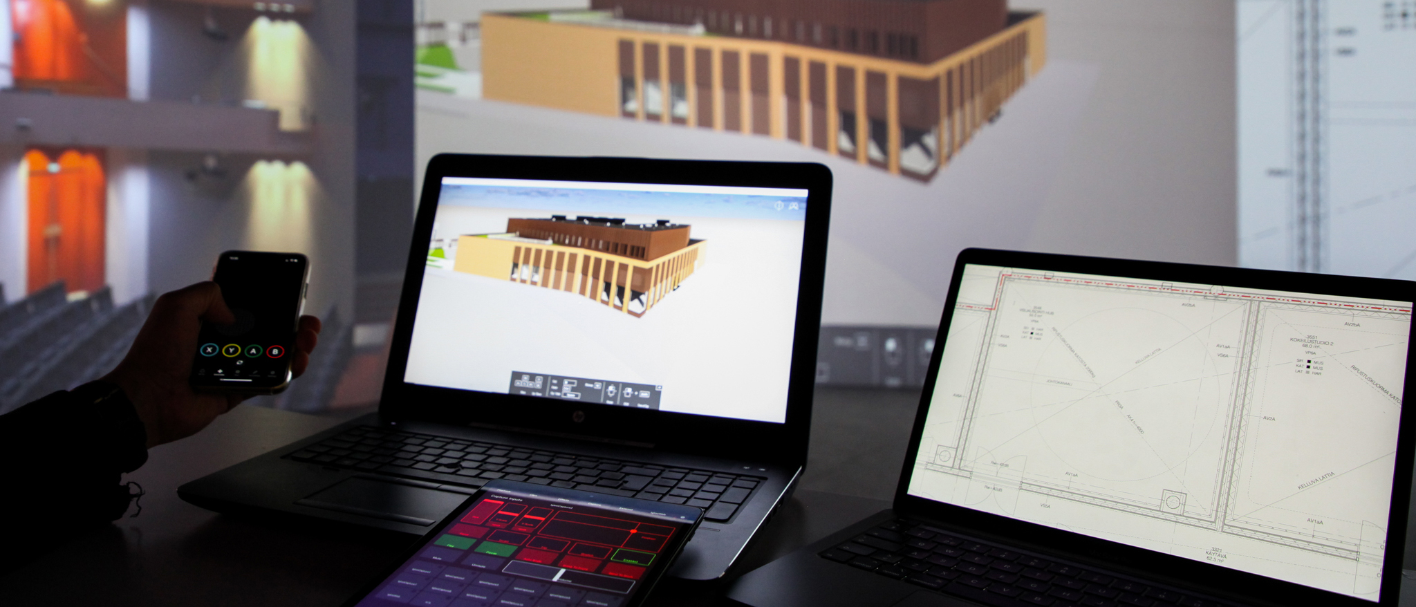Computers controlling a large projection